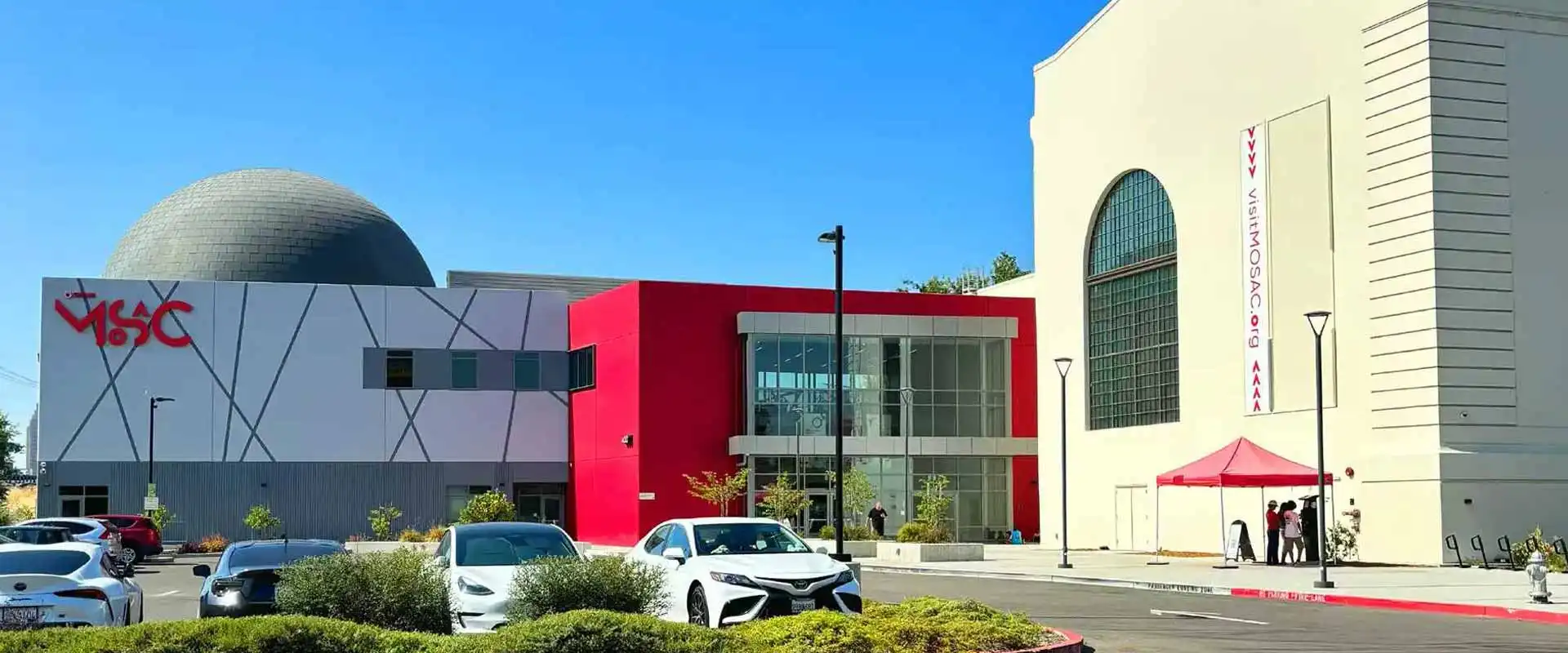 The large MOSAC building, home to Curiosity Café, has ample parking out front.